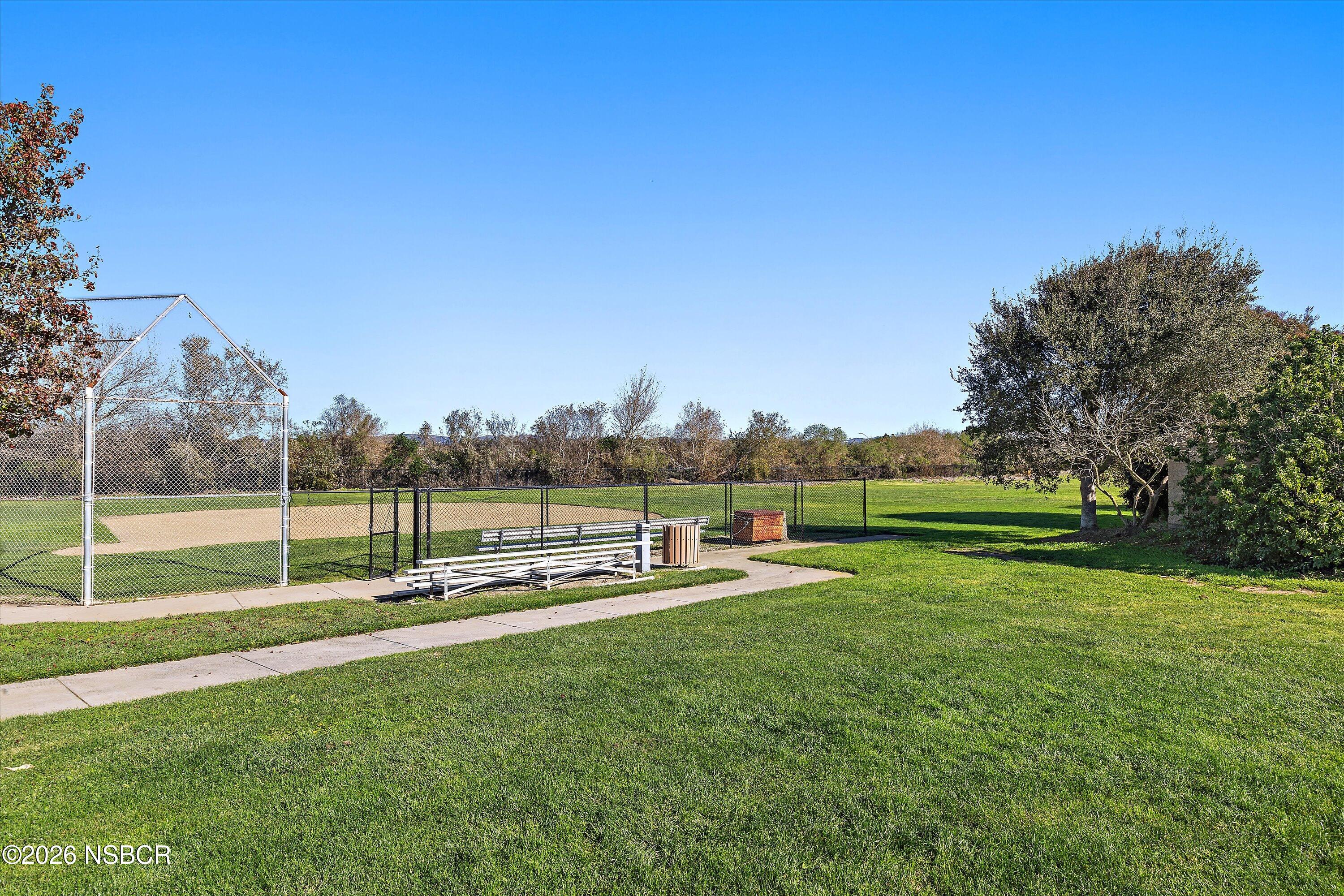 2020 Green Ridge Circle Lompoc, CA 93436 - Photo 15 of 20 a view of a swimming pool with a yard and sitting area