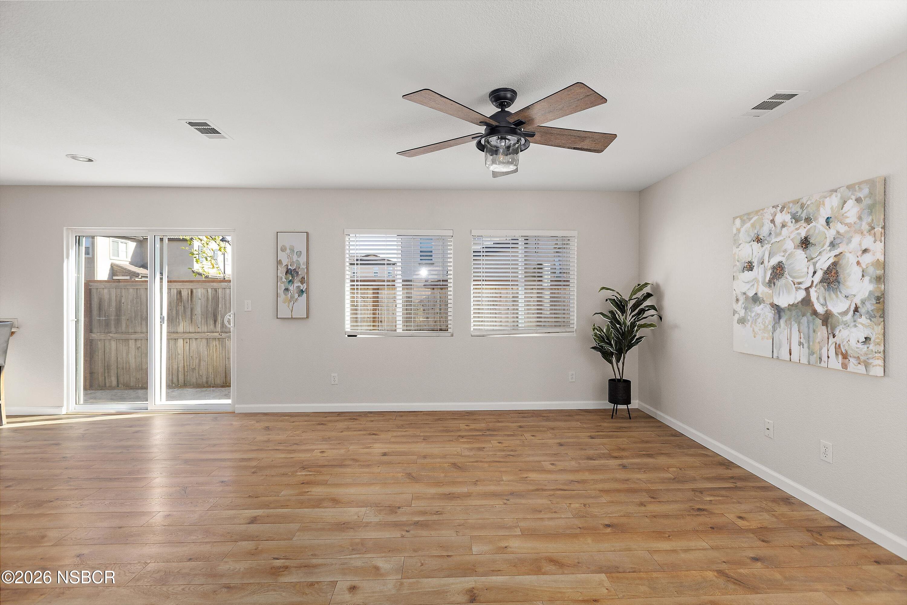 2020 Green Ridge Circle Lompoc, CA 93436 - Photo 5 of 20 a view of an empty room with wooden floor and a window
