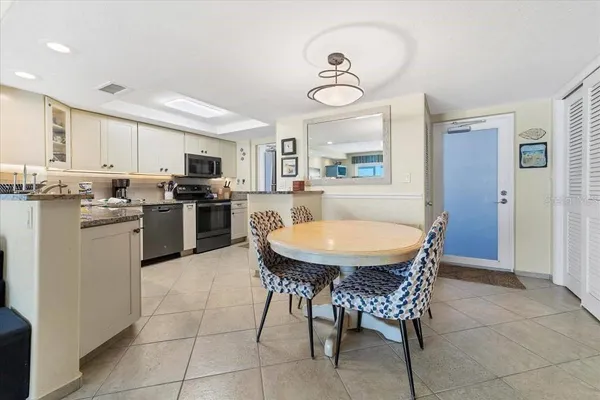 a dining room with furniture and window