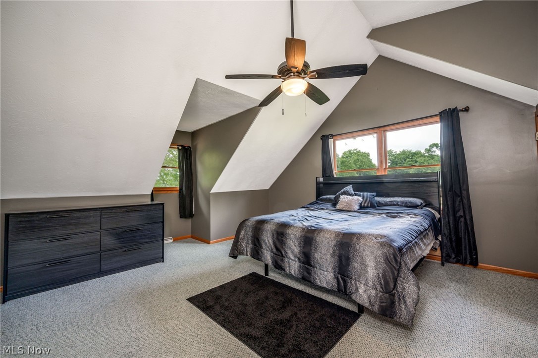1666 Warner Road Vienna, OH 44473 - Photo 15 of 41 Carpeted bedroom with ceiling fan and vaulted ceiling