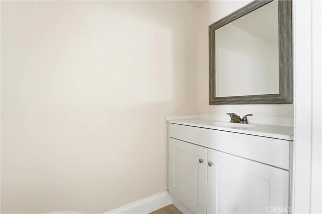 a kitchen with granite countertop cabinets stainless steel appliances a sink and a window