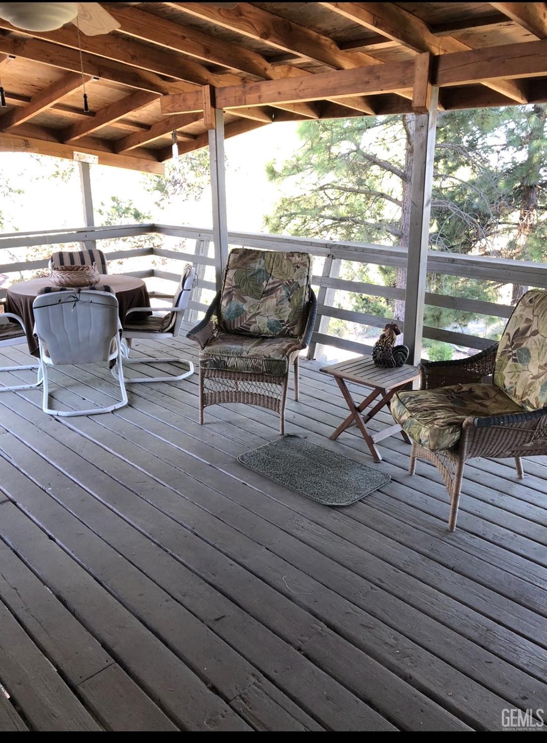 Undisclosed Address Posey, CA 93260 - Photo 13 of 16 a living room with patio furniture and wooden floor