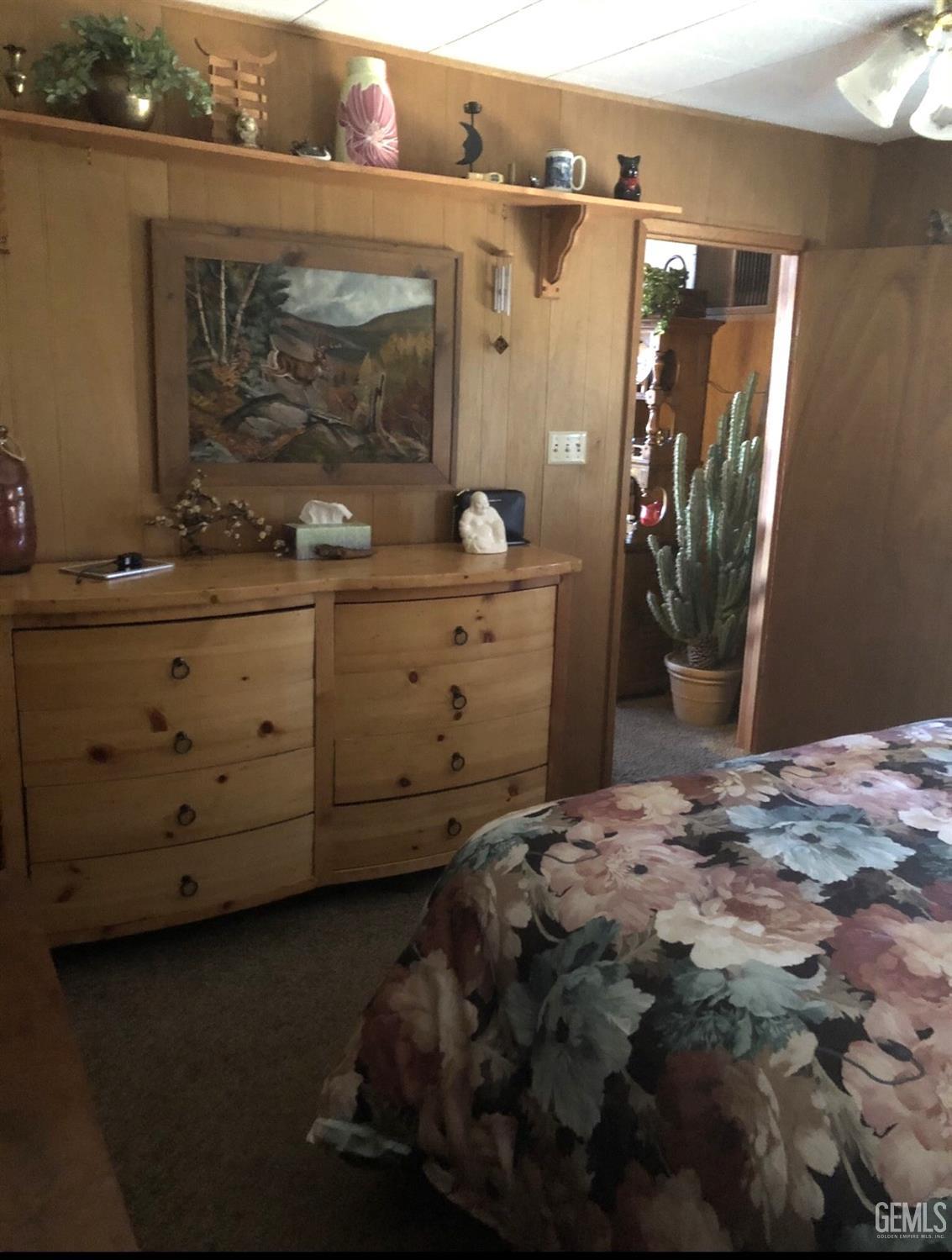 Undisclosed Address Posey, CA 93260 - Photo 8 of 16 a bedroom with a bed and a mirror on the dresser