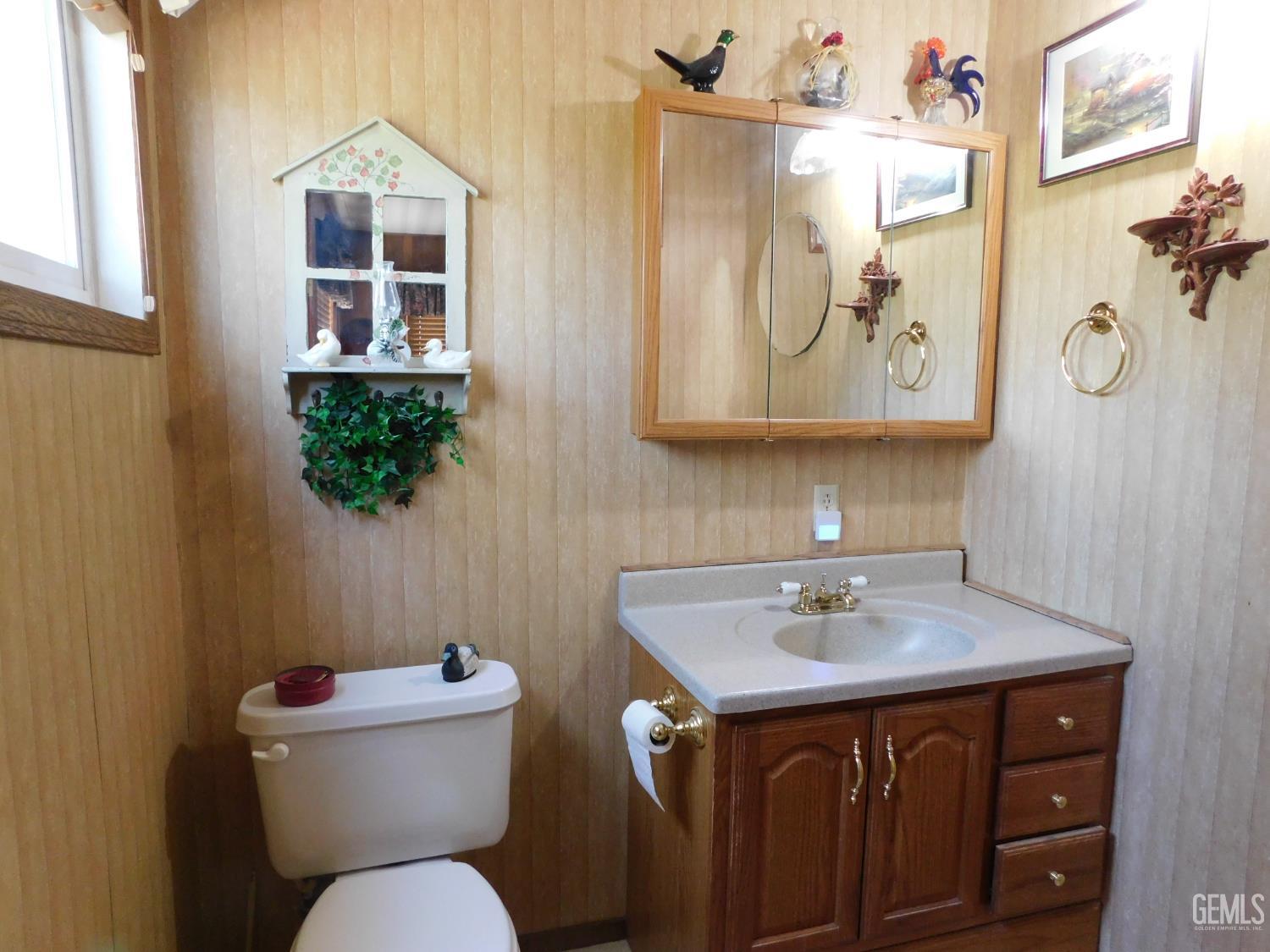 Undisclosed Address Posey, CA 93260 - Photo 9 of 16 a bathroom with a toilet sink and mirror