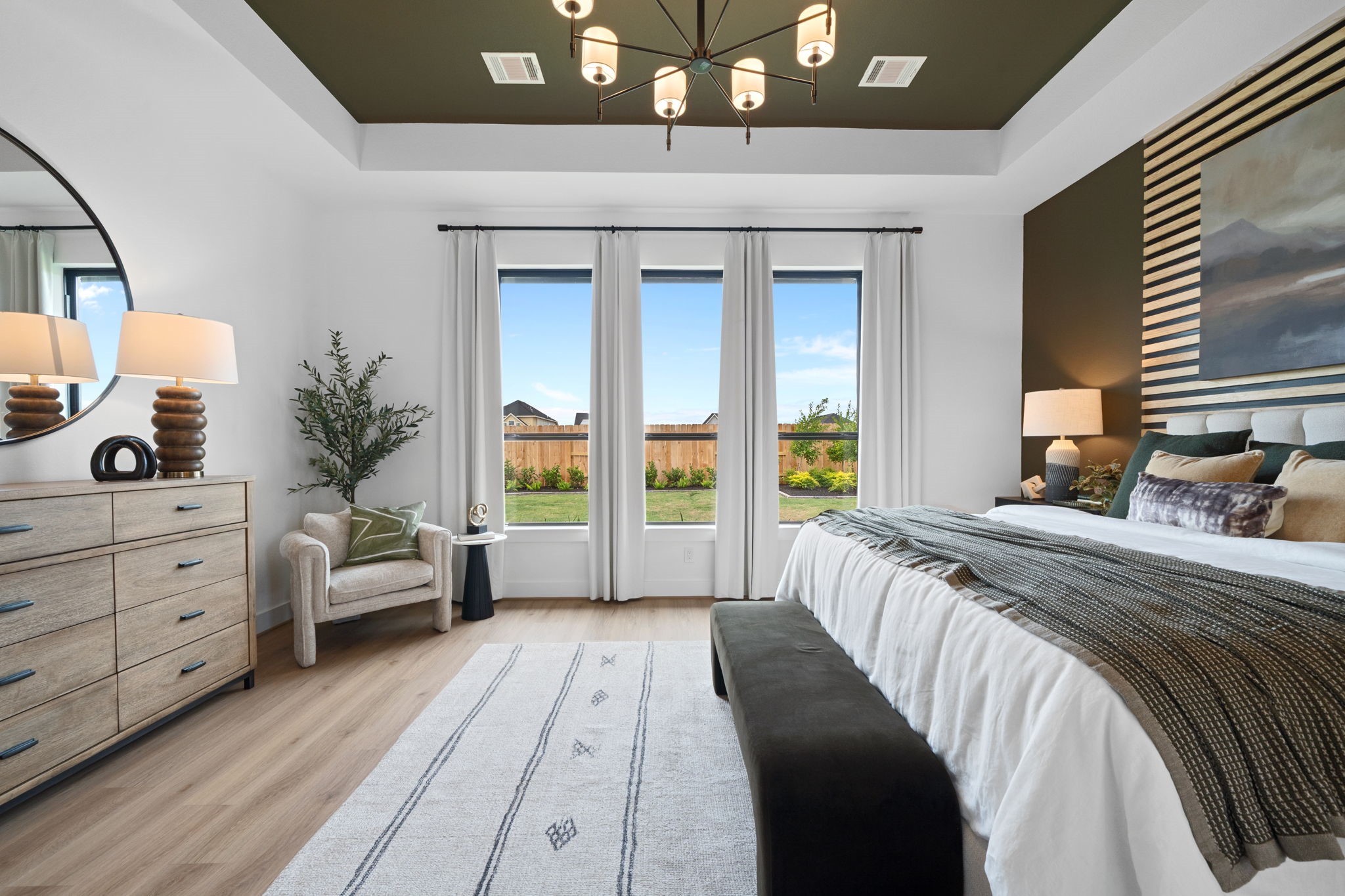 721 Cross Timbers Trace Hempstead, TX 77445 - Photo 12 of 22 a bedroom with a large bed and a chandelier