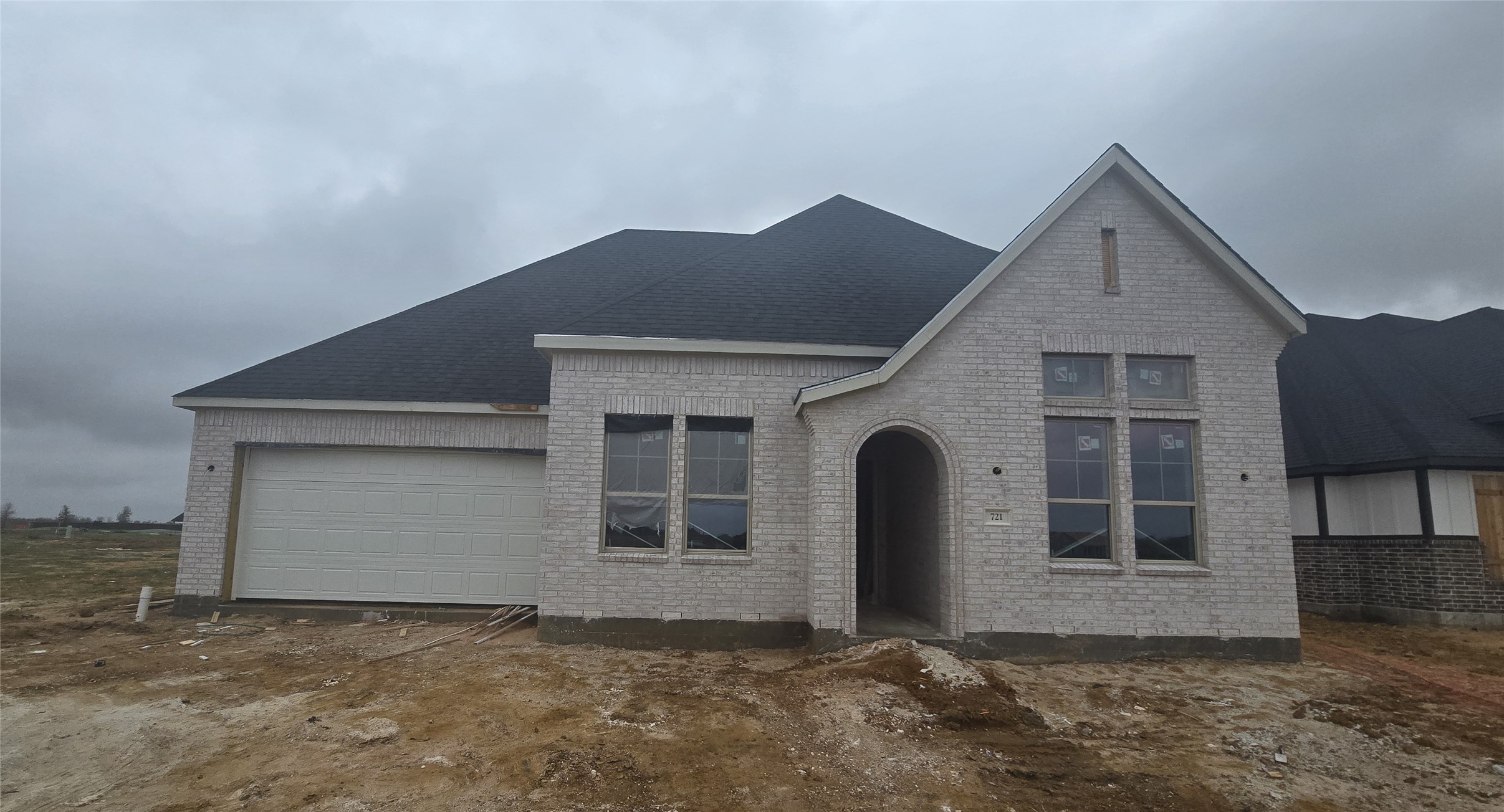 721 Cross Timbers Trace Hempstead, TX 77445 - Photo 2 of 22 a front view of a house with a yard and garage