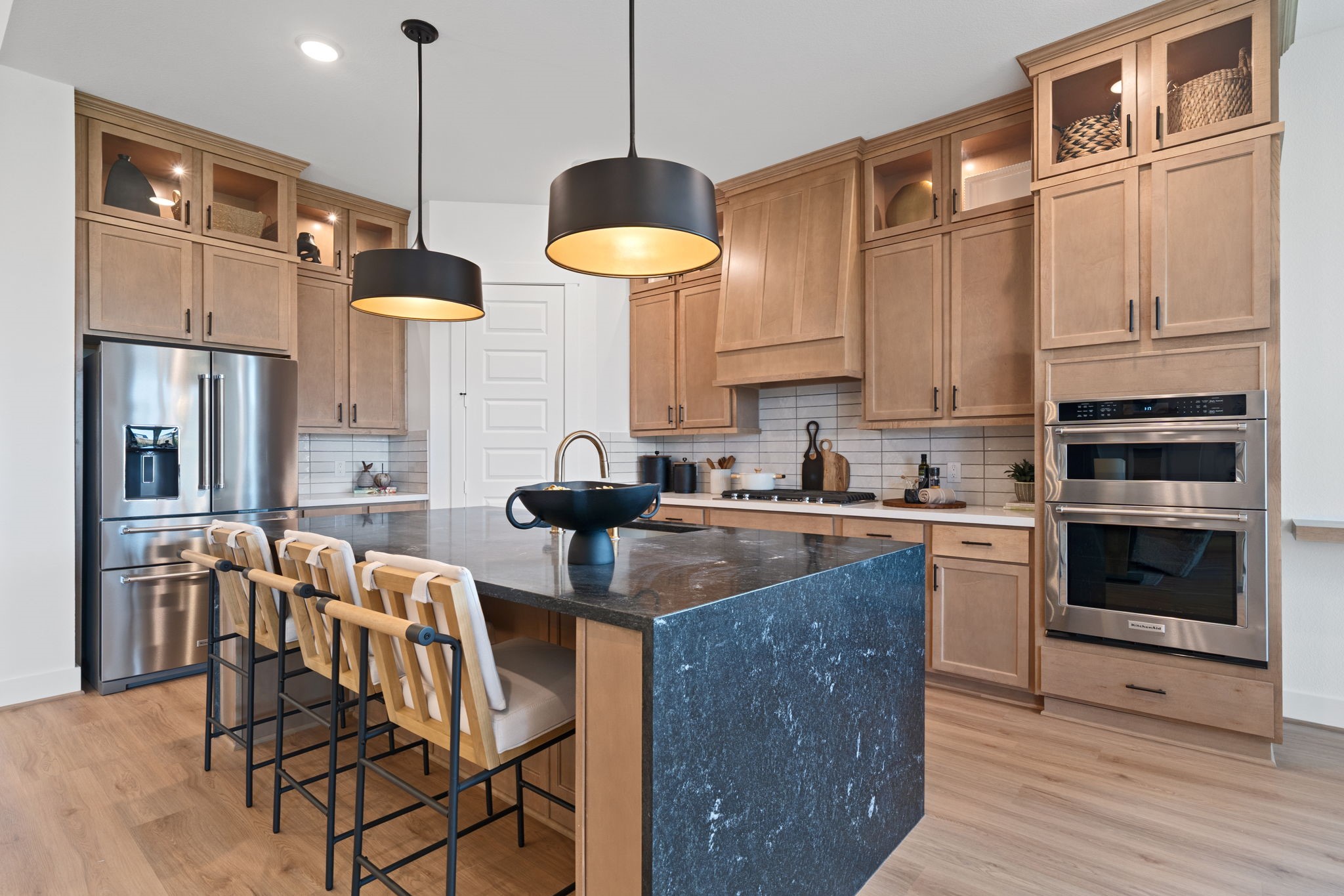 721 Cross Timbers Trace Hempstead, TX 77445 - Photo 5 of 22 a kitchen with stainless steel appliances granite countertop a stove a sink a refrigerator and a wooden cabinets