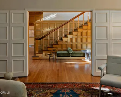 a view of a living room and dining room