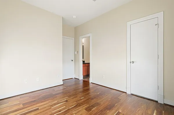 an empty room with wooden floor
