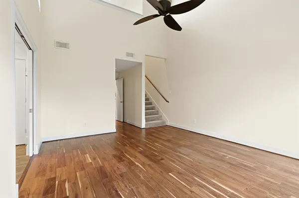 a view of an entryway with wooden floor