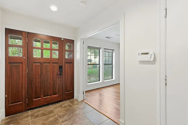 an empty room with windows and closet