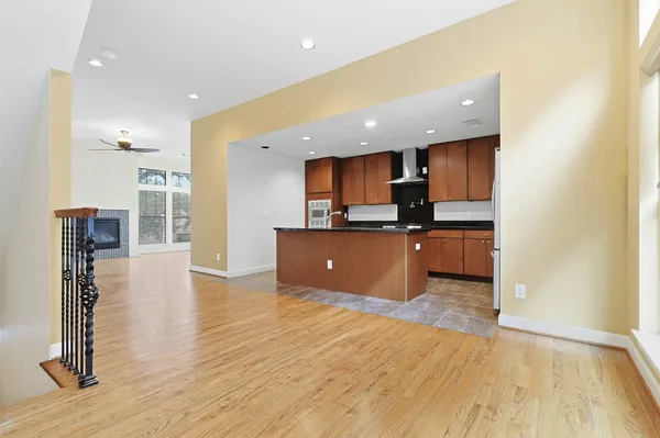 a kitchen with granite countertop a sink and a wooden cabinets