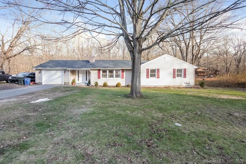 9 Munson Road Beacon Falls, CT 06403 - Photo 1 of 1 a front view of a house with a garden