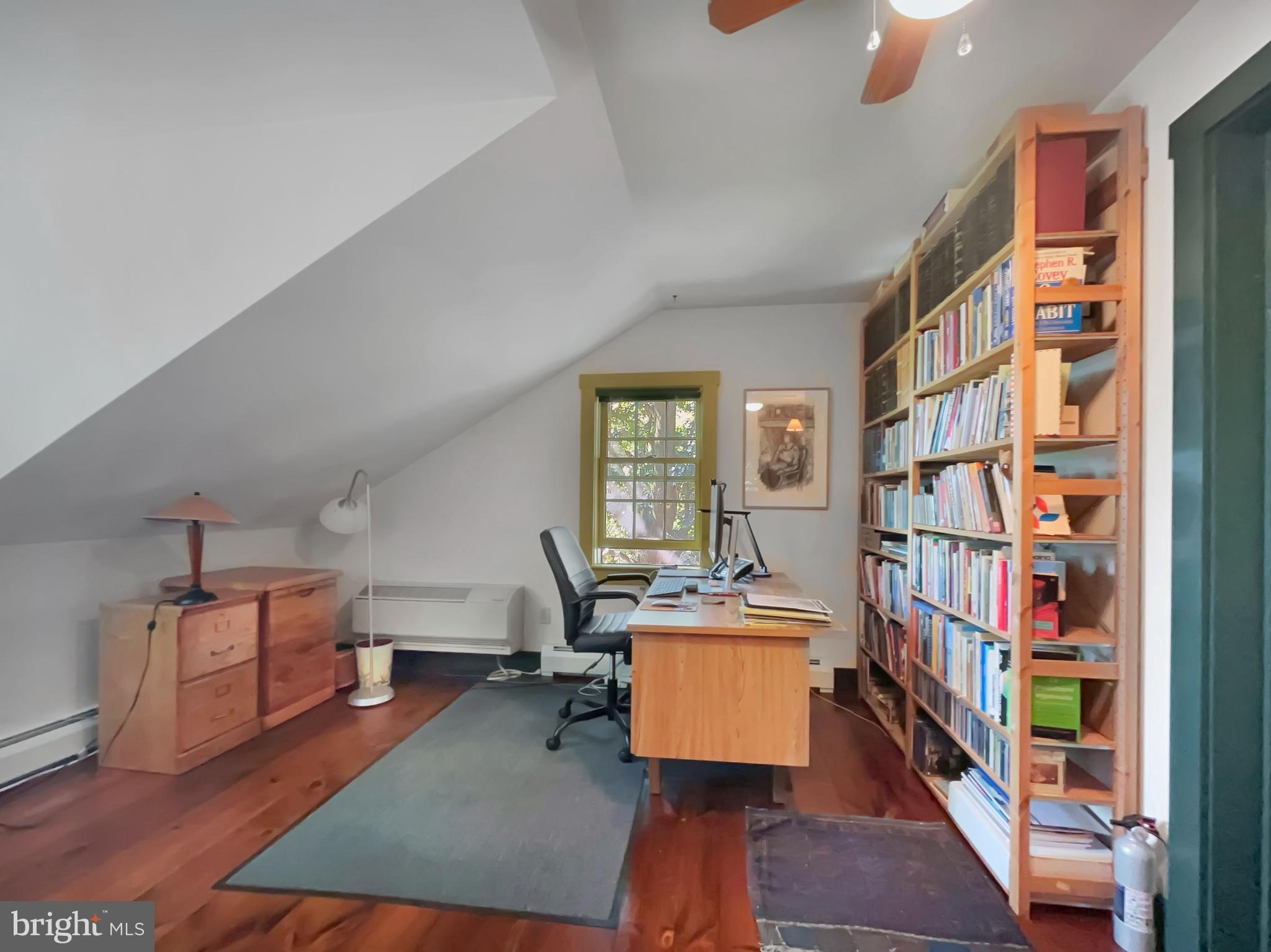 1095 Texter Mountain Road Denver, PA 17517 - Photo 19 of 37 a room with furniture and a book shelf