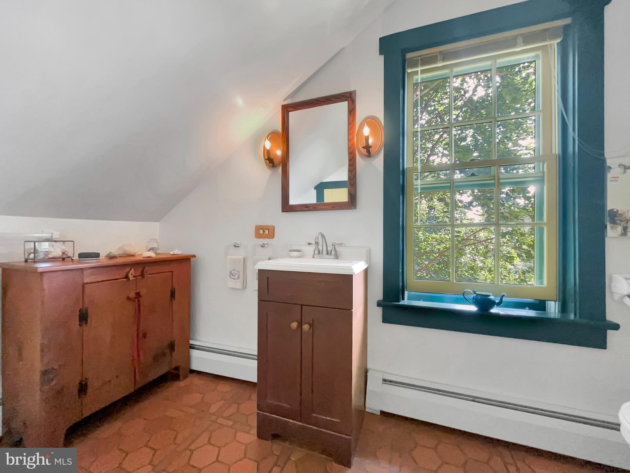 1095 Texter Mountain Road Denver, PA 17517 - Photo 20 of 37 a bathroom with a sink vanity and a mirror