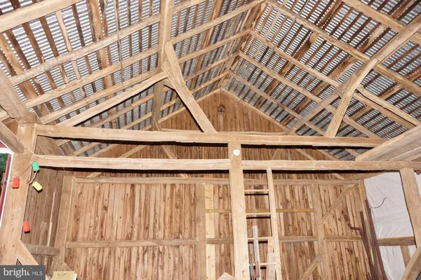 a view of outdoor space with green field and trees all around