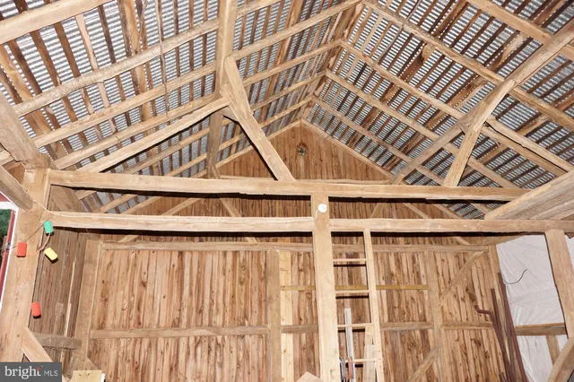 a view of outdoor space with green field and trees all around