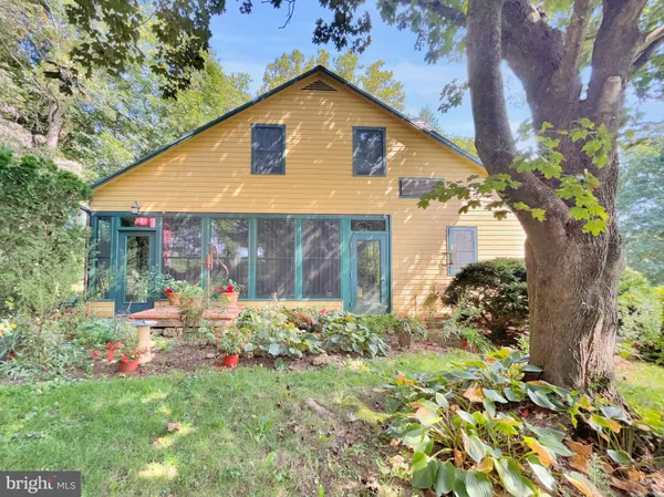 a front view of house with garden