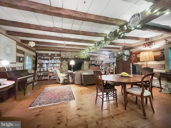 a living room with lots of furniture and a chandelier