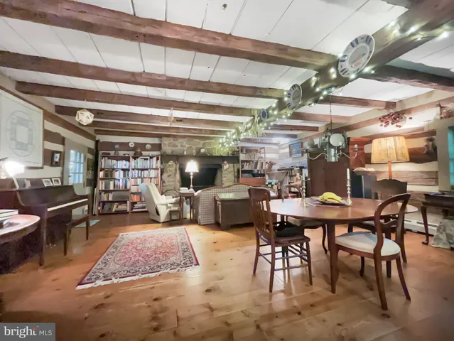 a living room with lots of furniture and a chandelier
