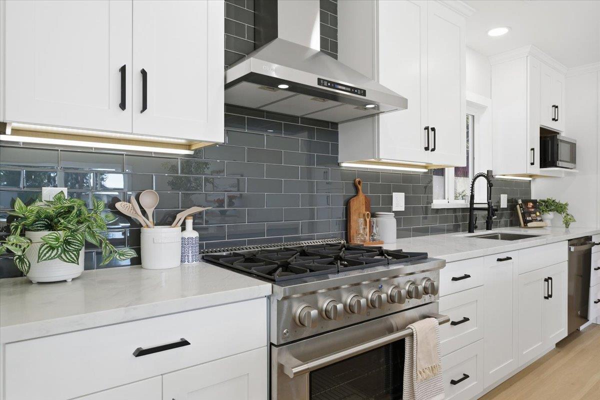 40 Valley View Avenue San Jose, CA 95127 - Photo 10 of 27 a kitchen with a stove and white cabinets