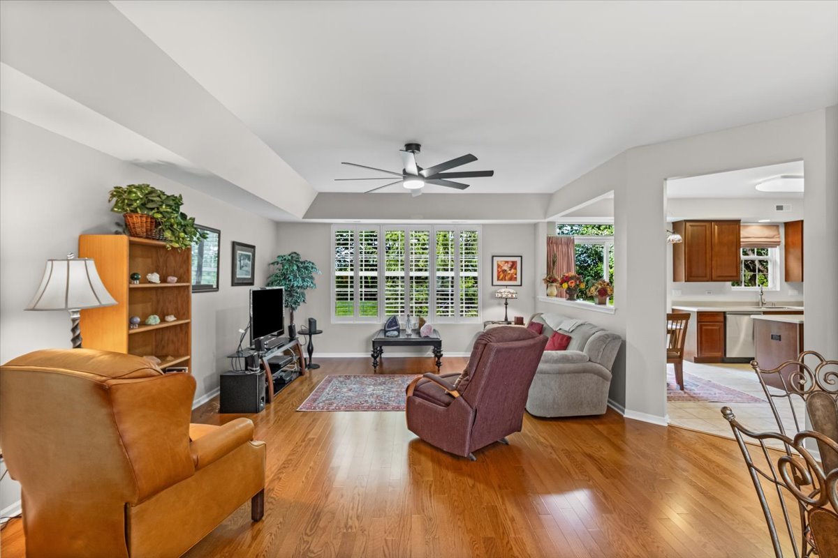 13544 Delaney Road Huntley, IL 60142 - Photo 5 of 21 a living room with furniture large window and wooden floor