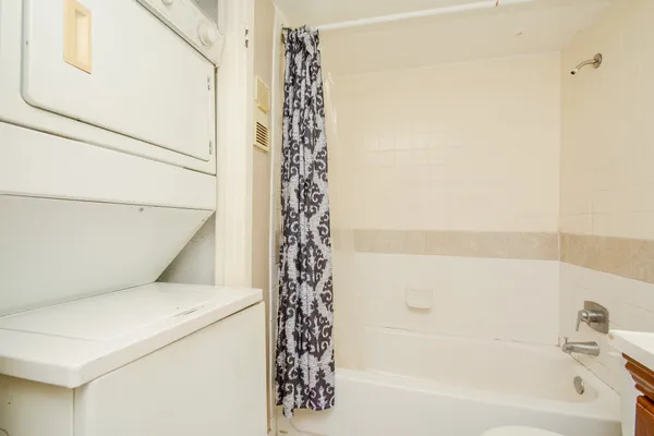 a bathroom with a bathtub and shower