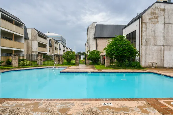 a view of an swimming pool with an outdoor seating