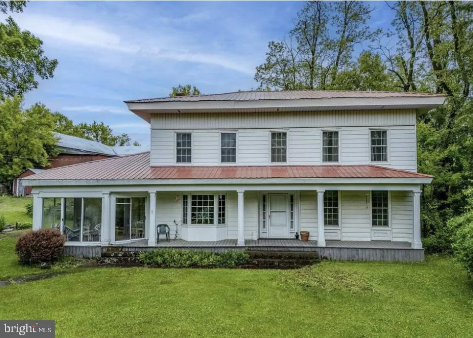 436 State Line Road Susquehanna, PA 18847 - Photo 2 of 35 a front view of a house with a yard