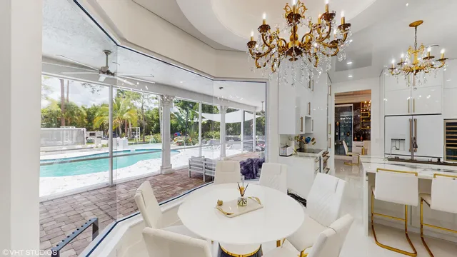 a living room with kitchen island furniture and a chandelier