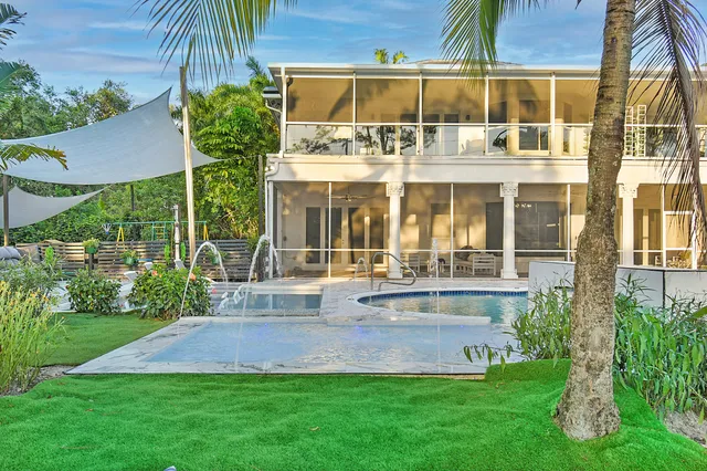 a view of a park with swings and a slide