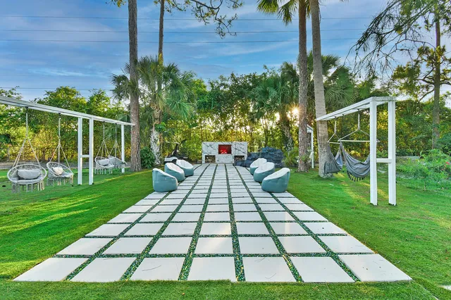 a view of backyard with wooden fence