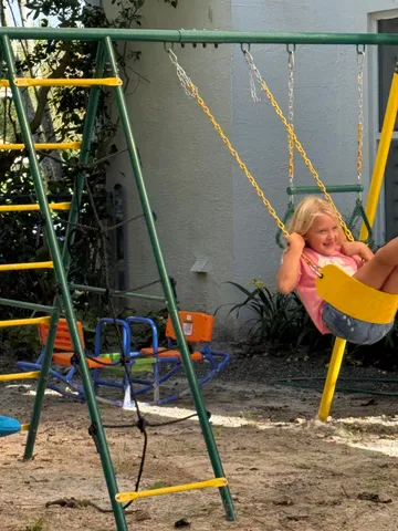 a living room with furniture and stairs