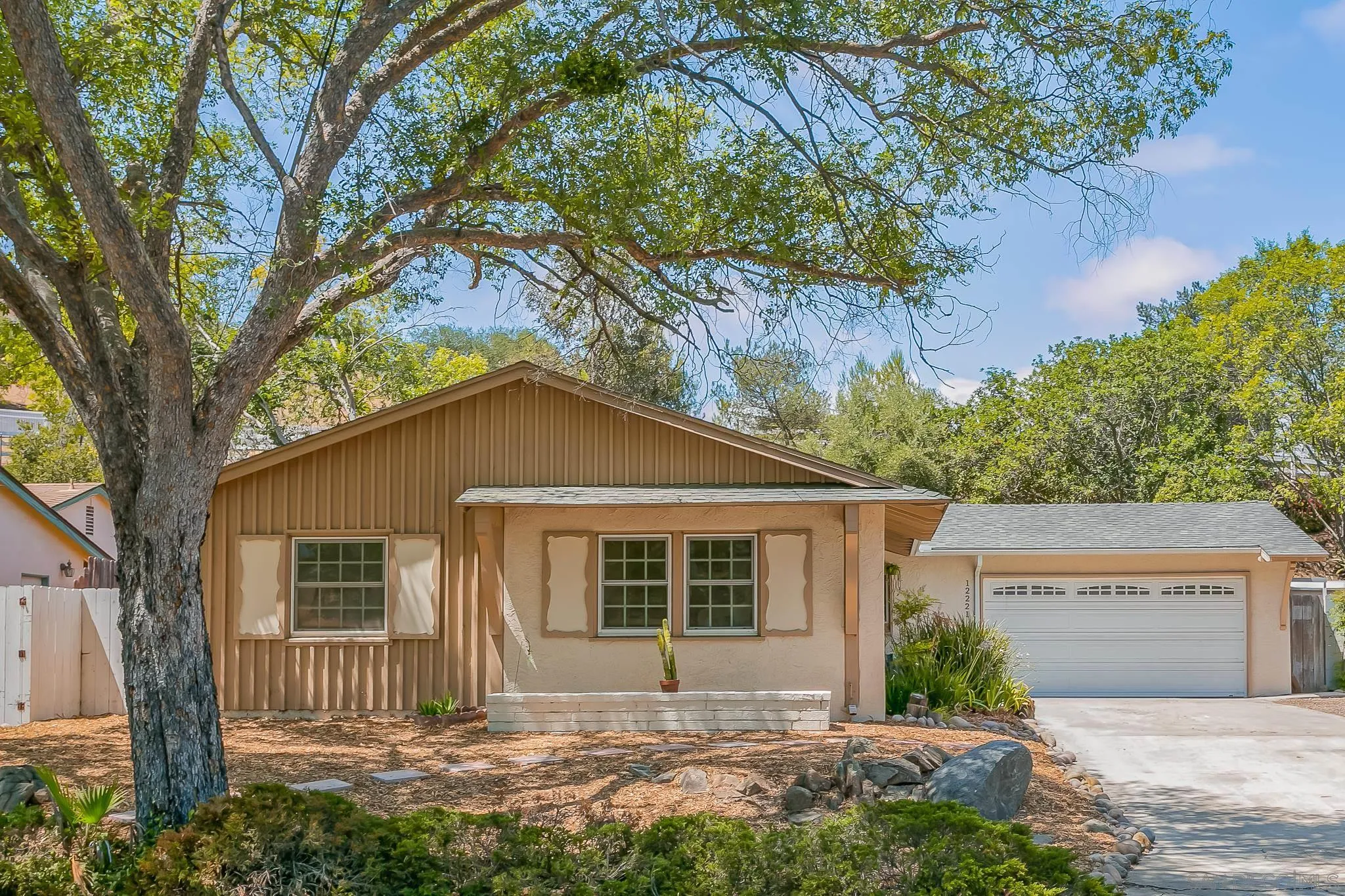 12221 Witt Road Poway, CA 92064 - Photo 20 of 30 a front view of a house with a garden