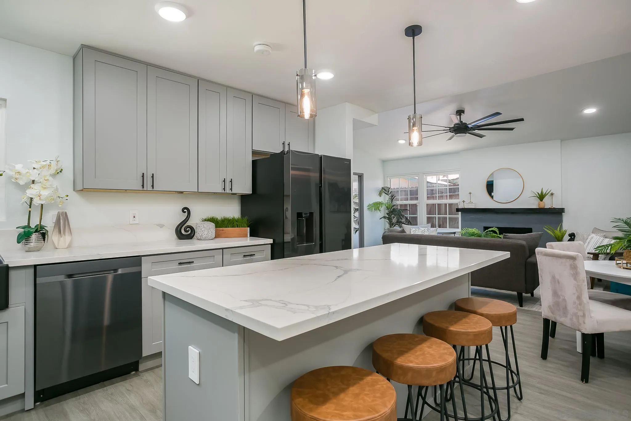 12221 Witt Road Poway, CA 92064 - Photo 3 of 30 a kitchen with a table chairs stove and refrigerator