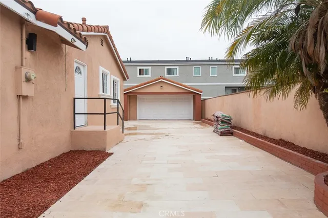a front view of a house with a yard and a garage