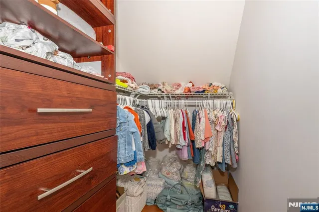 a view of a closet with storage