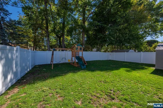 a backyard of a house and trees