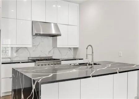 223 16th Street Northwest, Unit 8 Atlanta, GA 30363 - Photo 12 of 43 a kitchen with a sink and a cabinets