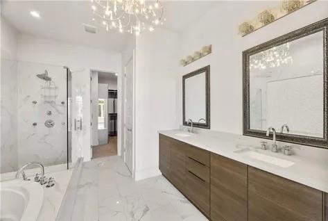 223 16th Street Northwest, Unit 8 Atlanta, GA 30363 - Photo 27 of 43 a spacious bathroom with a double vanity sink mirror double and shower