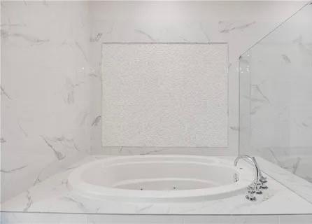 223 16th Street Northwest, Unit 8 Atlanta, GA 30363 - Photo 29 of 43 a bathroom with a shower and a bath tub