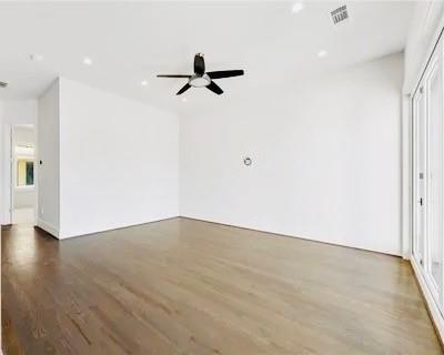 223 16th Street Northwest, Unit 8 Atlanta, GA 30363 - Photo 34 of 43 an empty room with wooden floor cabinet and windows
