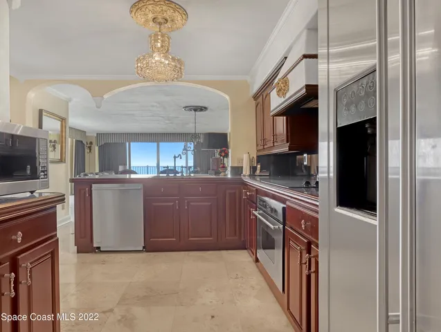 a kitchen with cabinets and window