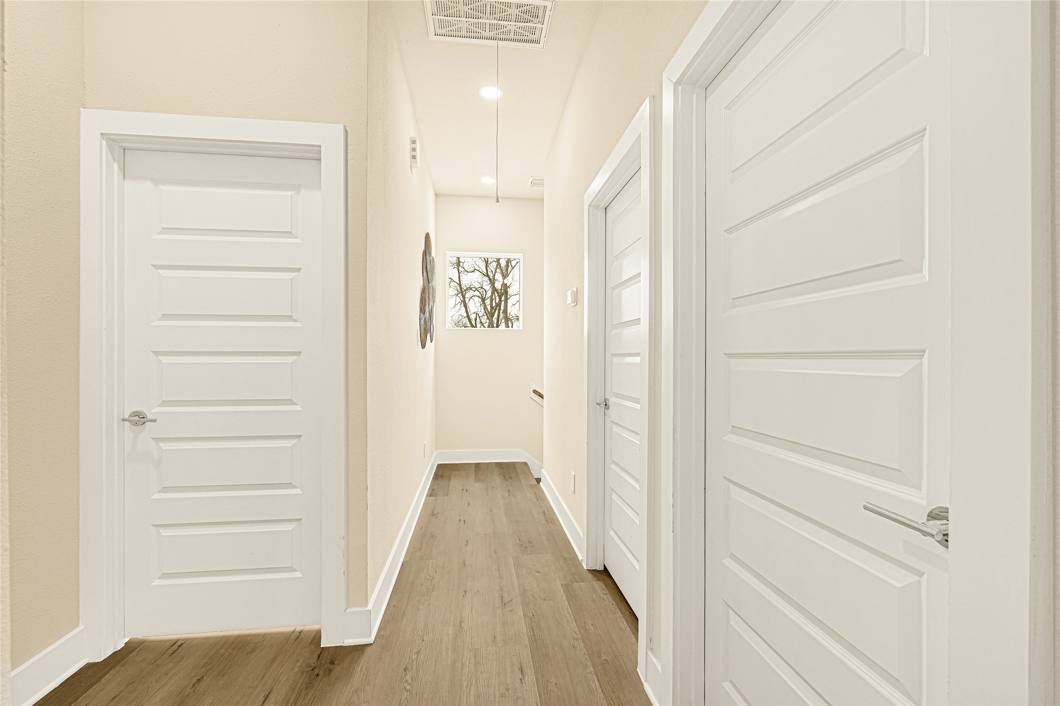 702 Savonna Houston, TX 77076 - Photo 13 of 28 a view of a hallway with wooden floor and closet