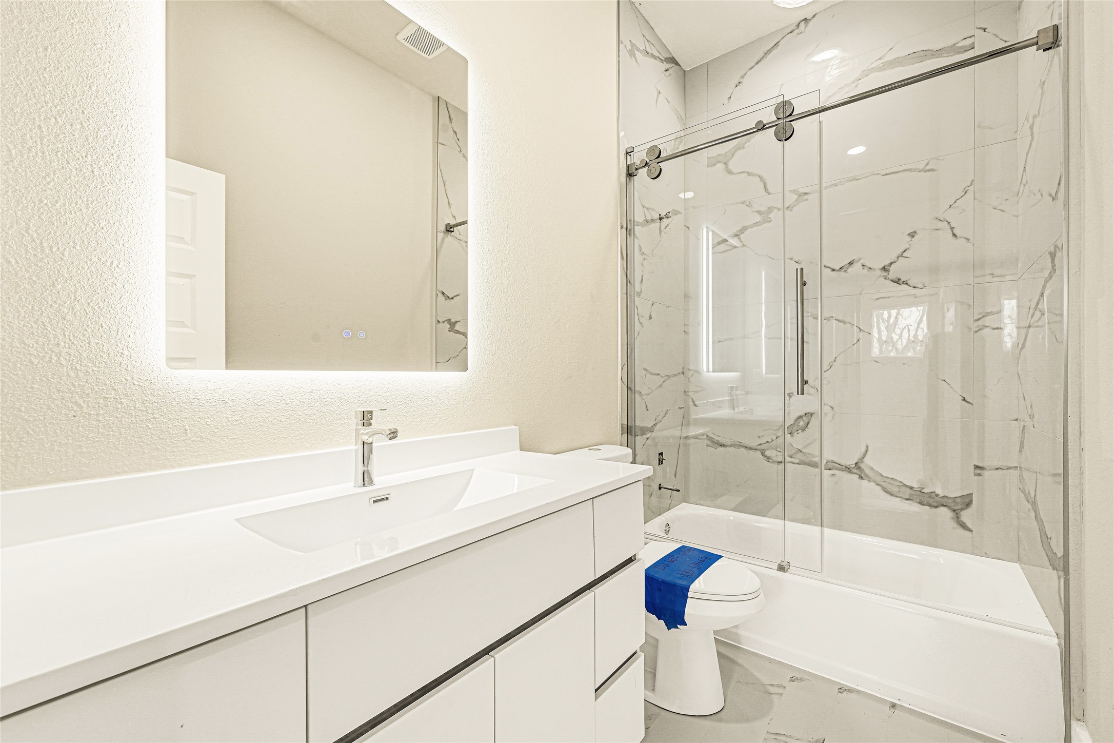 702 Savonna Houston, TX 77076 - Photo 17 of 28 a bathroom with a sink mirror toilet and bathtub