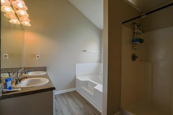 a bathroom with a sink and mirror