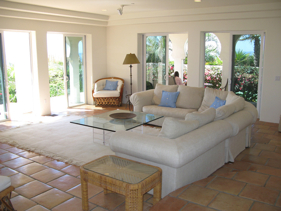 875 Sand Point Road Carpinteria, CA 93013 - Photo 3 of 12 a living room with furniture and a large window