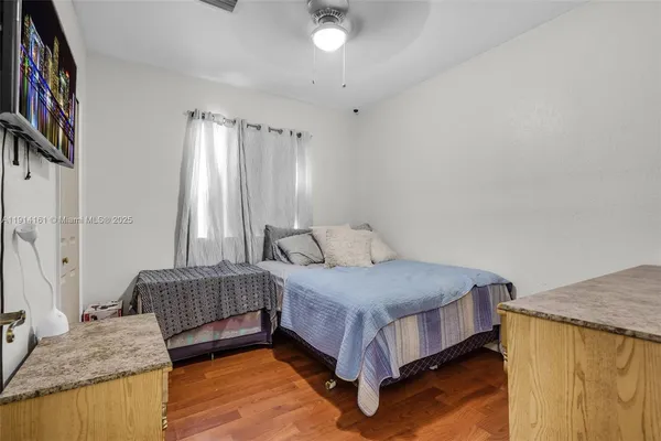 a bedroom with a bed and a couch