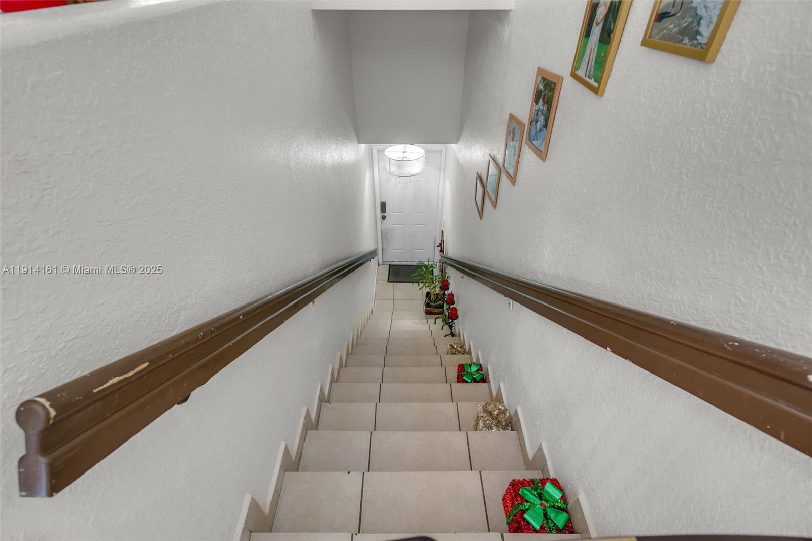 7271 Northwest 174th Terrace, Unit 202 Hialeah, FL 33015 - Photo 19 of 22 a hallway with stairs