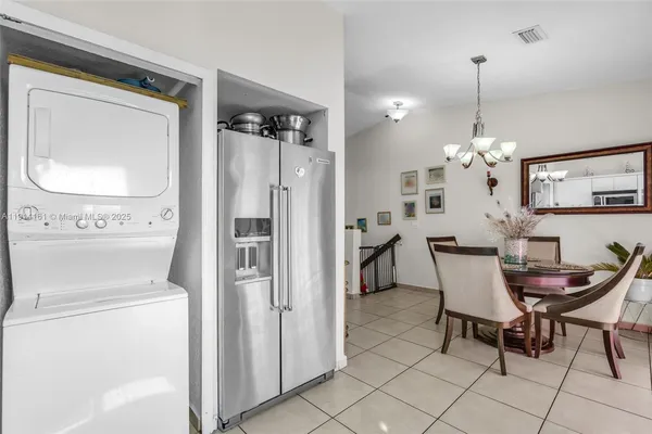 a view of kitchen and dining area with furniture